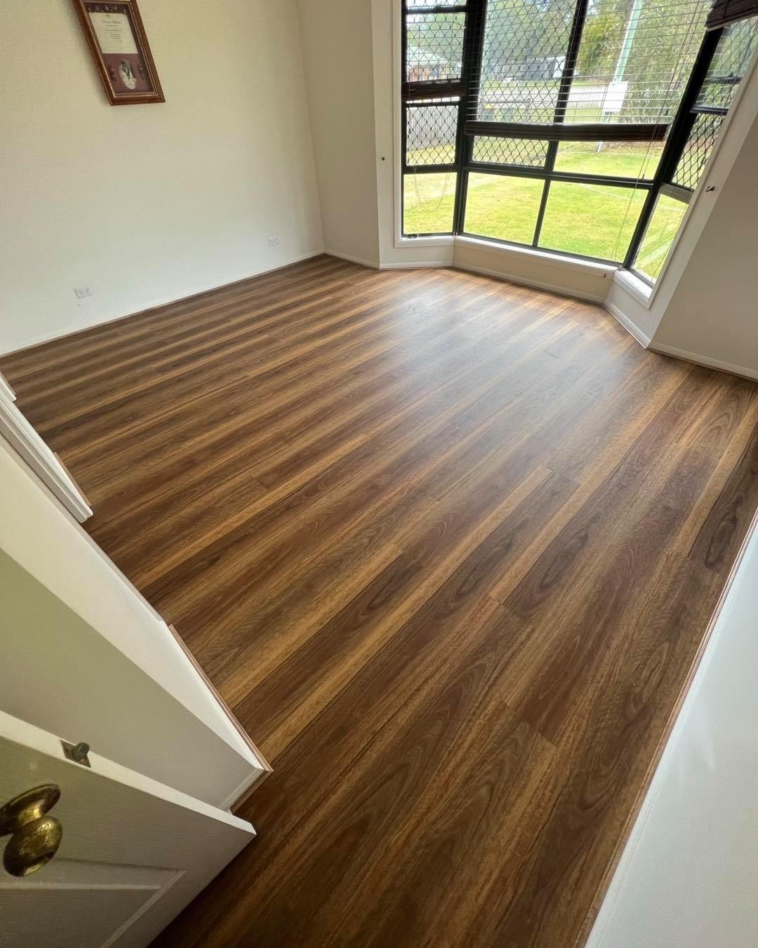 Dark walnut plank laid through a living area